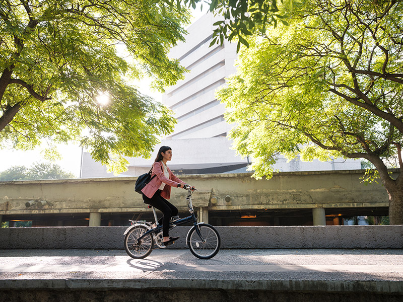 woman riding a bike downtown